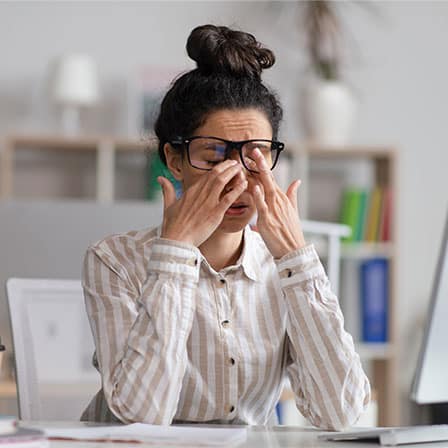 A woman suffering because of poor air quality in the home or office