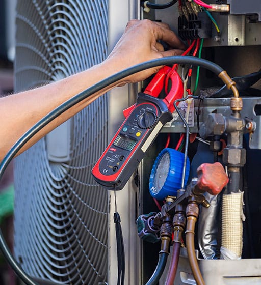An HVAC technician diagnosing problems