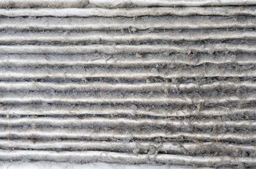 A very dirty and dusty air conditioning filter